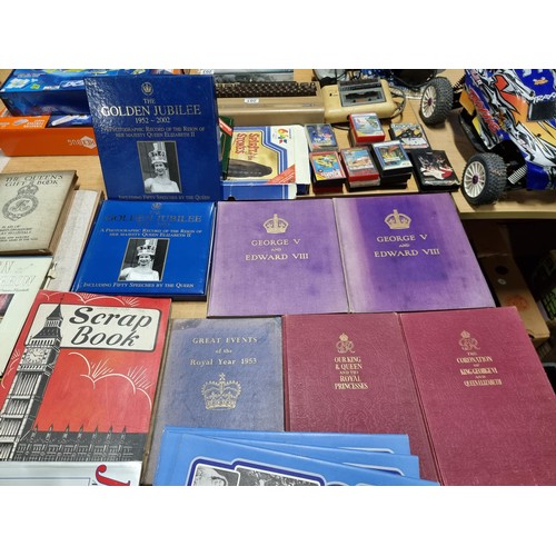 238 - A large collection of Royal memorabilia books including coronation books for King George V, Edward V... 