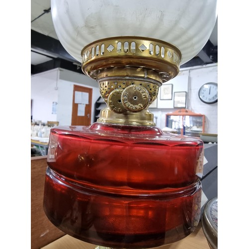 283 - Quantity of 3x brass oil lamps inc a good quality oil lamp with a ruby glass reservoir, 2x are compl... 