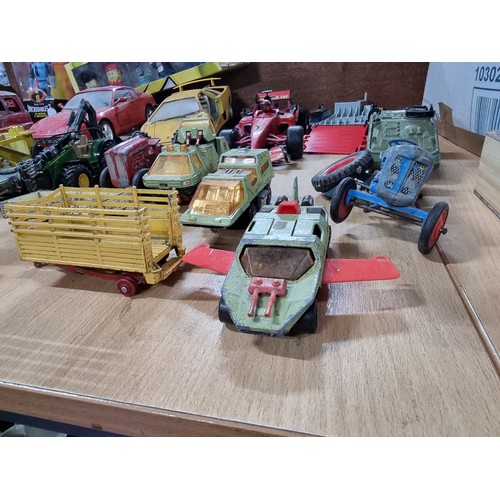 182 - A large collection of various vintage diecast vehicles including 5 tractors, 3 adventure 2000 vehicl... 