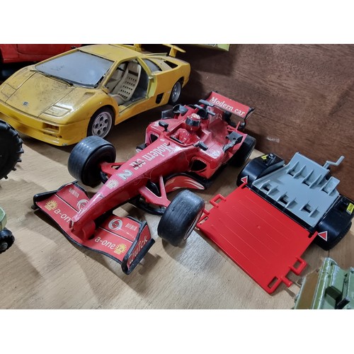 182 - A large collection of various vintage diecast vehicles including 5 tractors, 3 adventure 2000 vehicl... 