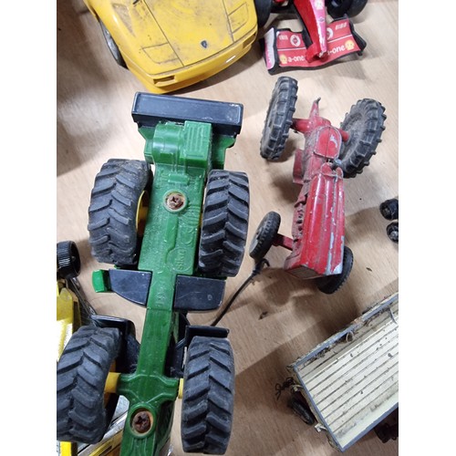 182 - A large collection of various vintage diecast vehicles including 5 tractors, 3 adventure 2000 vehicl... 