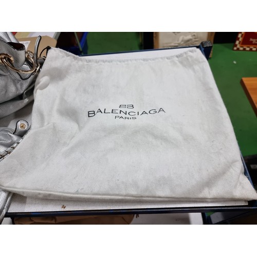 187 - 3 x ladies handbags including a good quality Balenciaga white leather handbag with its dust cover al... 