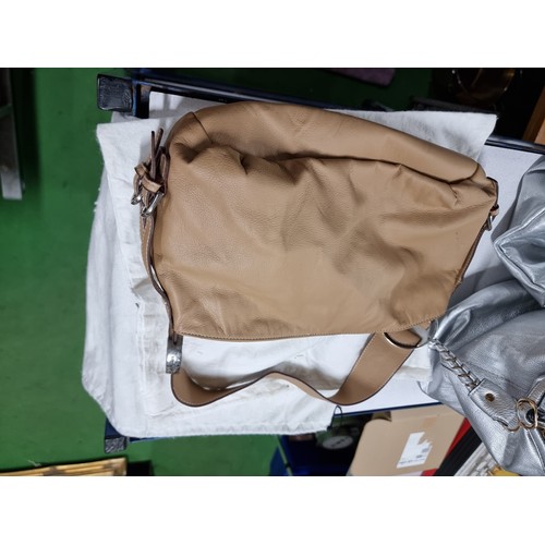 187 - 3 x ladies handbags including a good quality Balenciaga white leather handbag with its dust cover al... 