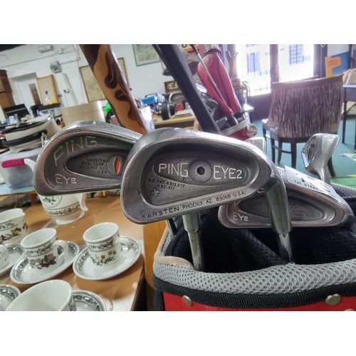 196 - A full set of golf irons by ping 7 are ping eye and one is ping eye no2 in a good quality free stand... 