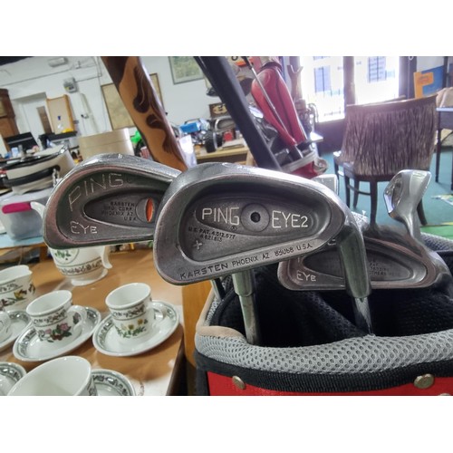 196 - A full set of golf irons by ping 7 are ping eye and one is ping eye no2 in a good quality free stand... 