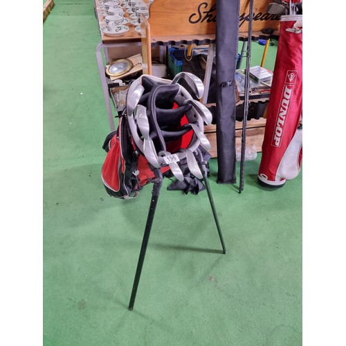 196 - A full set of golf irons by ping 7 are ping eye and one is ping eye no2 in a good quality free stand... 