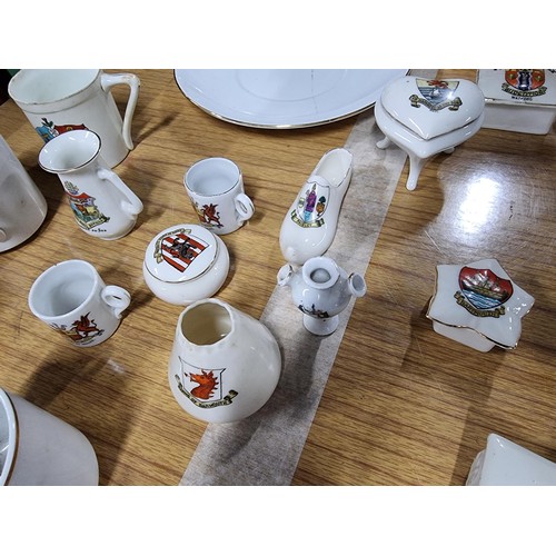 204 - Approx 59 pieces of various crested china items mostly relating to lidded boxes. Including 4 x Wales... 