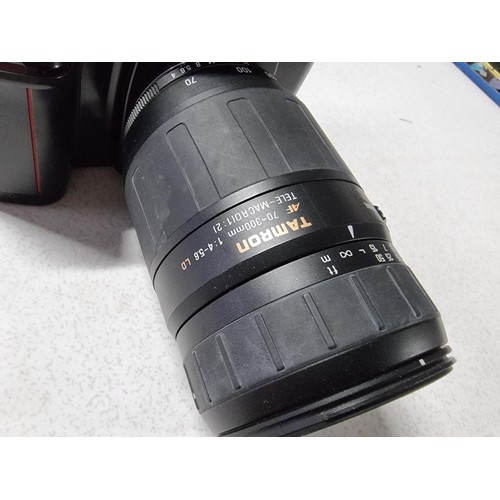 211 - A Nikon F/601 35mm camera with a Tamron 70/300mm tele/macro lens, in working condition but requires ... 