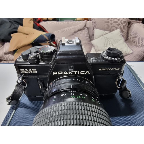 212 - A praktica BMS electronic 35mm camera fitted with a prakticar pentacon 70/200mm lens in good working... 