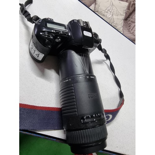 214 - A Canon EOS500 35mm camera with a Sigma auto focus DL zoom 75/300mm lens. In good working condition ... 