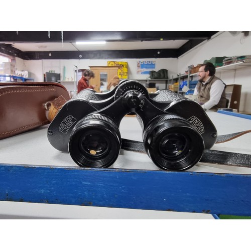 217 - A vintage pair of Carl zeiss jena jenoptem 8x30w binoculars in excellent condition with original lea... 