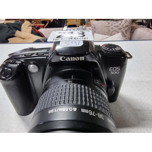 218 - A Canon EOS500 35mm camera with a Canon zoom lens 38/76mm lens. In good working condition just requi... 