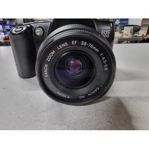 218 - A Canon EOS500 35mm camera with a Canon zoom lens 38/76mm lens. In good working condition just requi... 