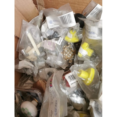 21 - Large quantity of new and sealed ceramic door knobs plastic door knobs, etc all in good order