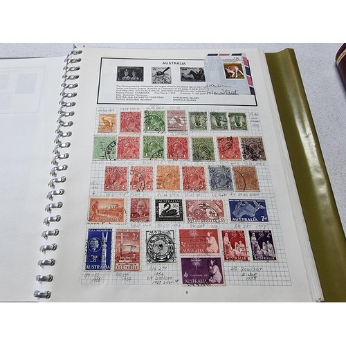 224 - A new world stamp album containing a large quantity of stamps from around the world along with an em... 