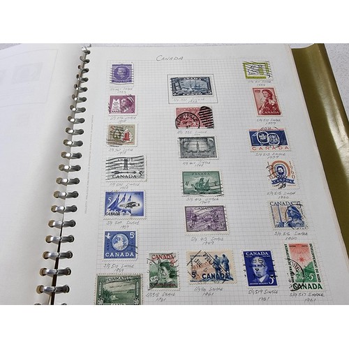 224 - A new world stamp album containing a large quantity of stamps from around the world along with an em... 