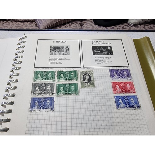 224 - A new world stamp album containing a large quantity of stamps from around the world along with an em... 