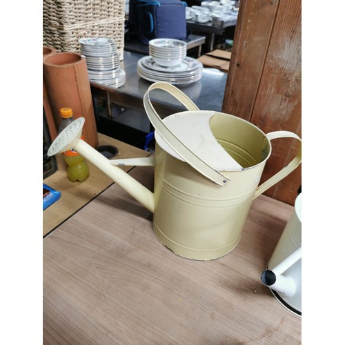 40 - Quantity 3x garden metal watering cans, 2 metal jugs and a ornamental small churn. Height of tallest... 