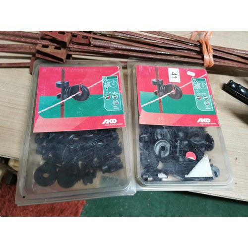 41 - Large quantity of electric fence equipment inc 25 spikes, reel of electric fence wire along with a s... 