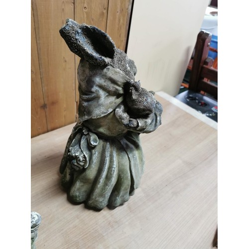 45 - Pair of vintage stoneware garden figures, Mr and Mrs Rabbit holding baby rabbits, in overall good or... 