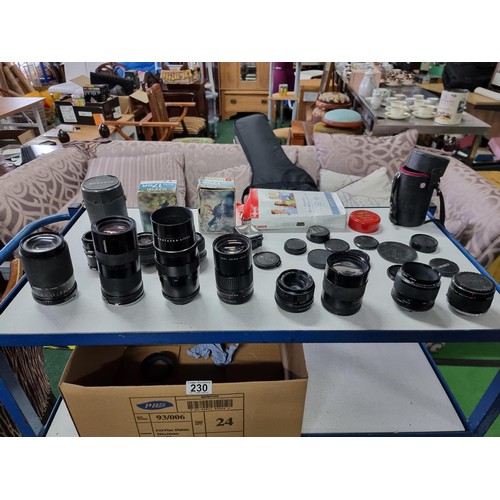 230 - A large collection of 10 x various vintage camera lenses along with some accessories including a Car... 