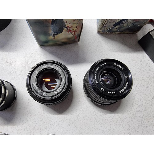 230 - A large collection of 10 x various vintage camera lenses along with some accessories including a Car... 