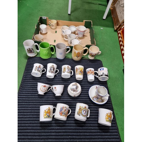 243 - A box containing a large quantity of vintage royal commemorative china mostly mugs with various make... 