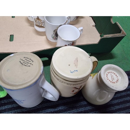 243 - A box containing a large quantity of vintage royal commemorative china mostly mugs with various make... 