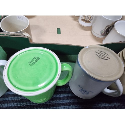 243 - A box containing a large quantity of vintage royal commemorative china mostly mugs with various make... 