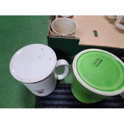 243 - A box containing a large quantity of vintage royal commemorative china mostly mugs with various make... 