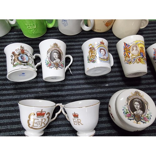 243 - A box containing a large quantity of vintage royal commemorative china mostly mugs with various make... 