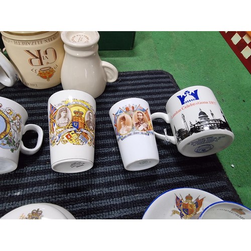 243 - A box containing a large quantity of vintage royal commemorative china mostly mugs with various make... 