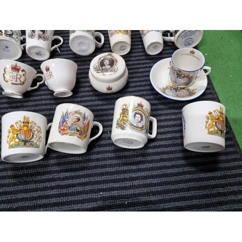 243 - A box containing a large quantity of vintage royal commemorative china mostly mugs with various make... 