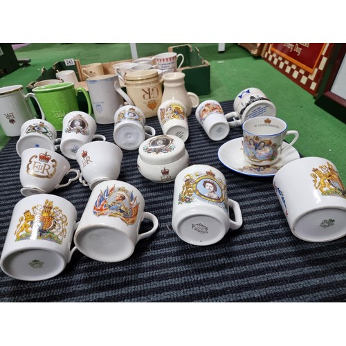 243 - A box containing a large quantity of vintage royal commemorative china mostly mugs with various make... 