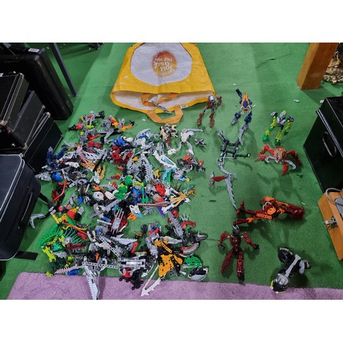 249 - A very large collection of various Lego Bionicle figures and accessories.