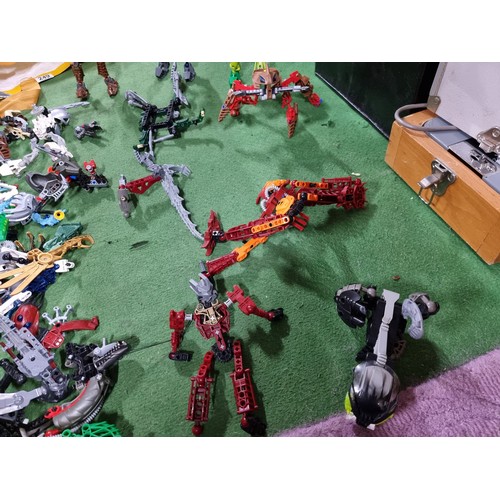 249 - A very large collection of various Lego Bionicle figures and accessories.