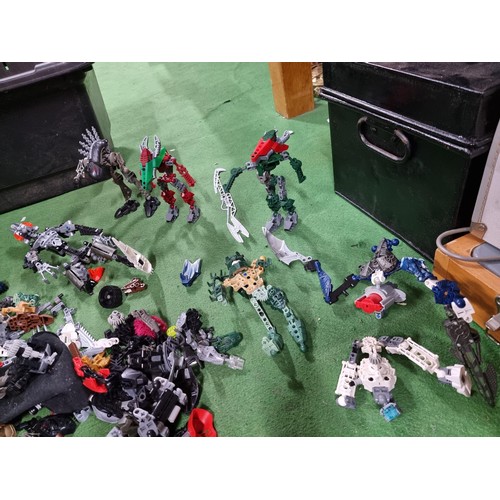 250 - A very large collection of Lego Bionicle figures parts and accessories all stored in a big black box... 