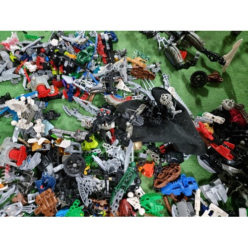 250 - A very large collection of Lego Bionicle figures parts and accessories all stored in a big black box... 