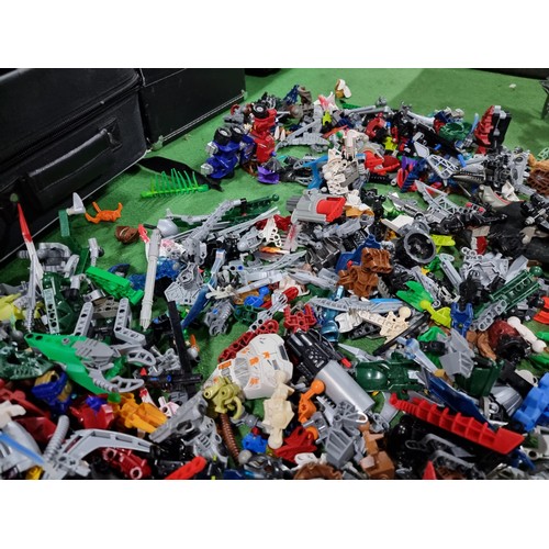 250 - A very large collection of Lego Bionicle figures parts and accessories all stored in a big black box... 