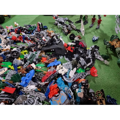 250 - A very large collection of Lego Bionicle figures parts and accessories all stored in a big black box... 