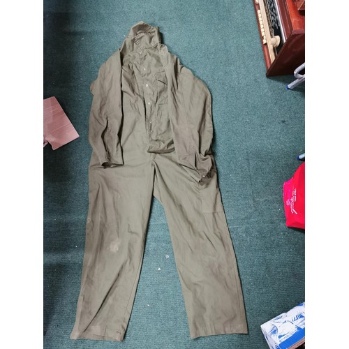 78 - Collection of camouflage clothing inc all weather trousers along with a camouflage rucksack