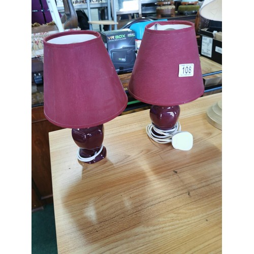 108 - 2x pairs of table lamps inc pair of wooden lamps and a pair of ceramic lamps, along with a brass can... 