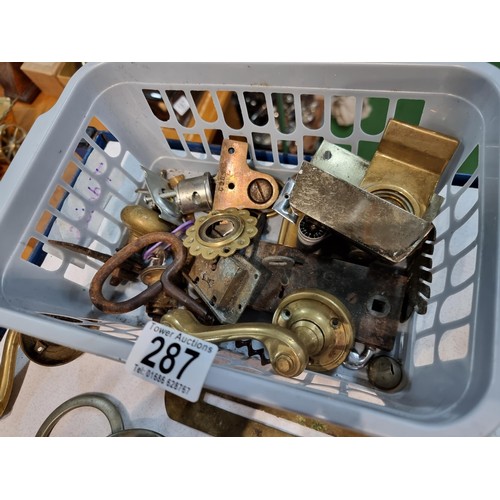 287 - Basket full of various brassware including door locks and keys a vintage petrol cap with key