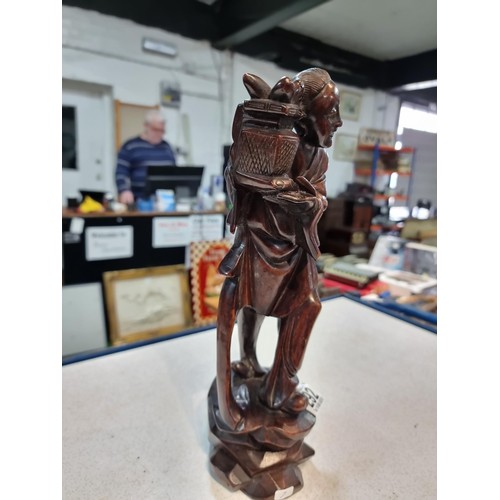 292 - Good antique solid woo carved figure of an Asian lady holding a plant, nice detail slight a/f see pi... 