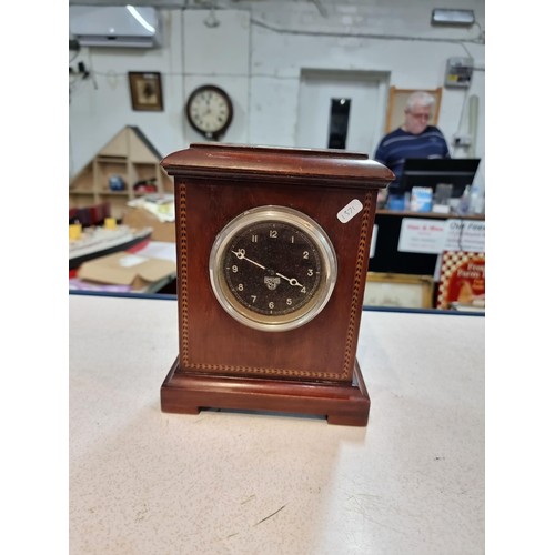 295 - Smith clock looks like from a vintage car fitted into a mahogany surround. tests as working