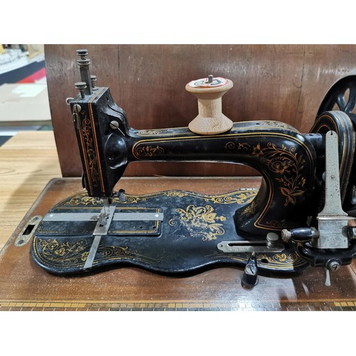 269 - Antique 1875 Singer sewing machine in excellent condition in original case along with a quantity of ... 