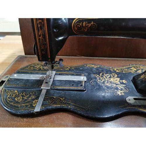 269 - Antique 1875 Singer sewing machine in excellent condition in original case along with a quantity of ... 