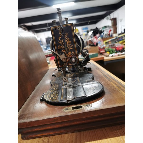 269 - Antique 1875 Singer sewing machine in excellent condition in original case along with a quantity of ... 