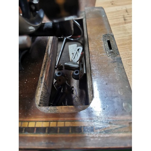 269 - Antique 1875 Singer sewing machine in excellent condition in original case along with a quantity of ... 