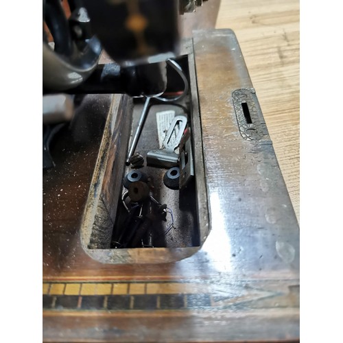 269 - Antique 1875 Singer sewing machine in excellent condition in original case along with a quantity of ... 